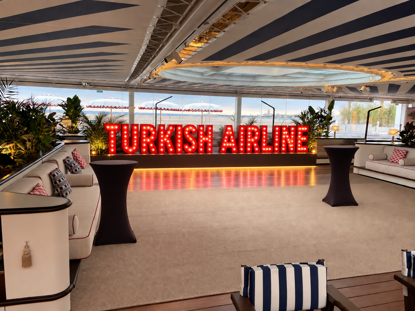 Event concept with large red Turkish Airline marquee letters in the Cannes lounge