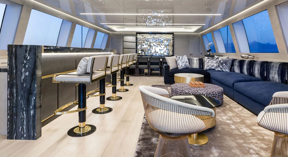 Yacht interior with lounge seating and a bar