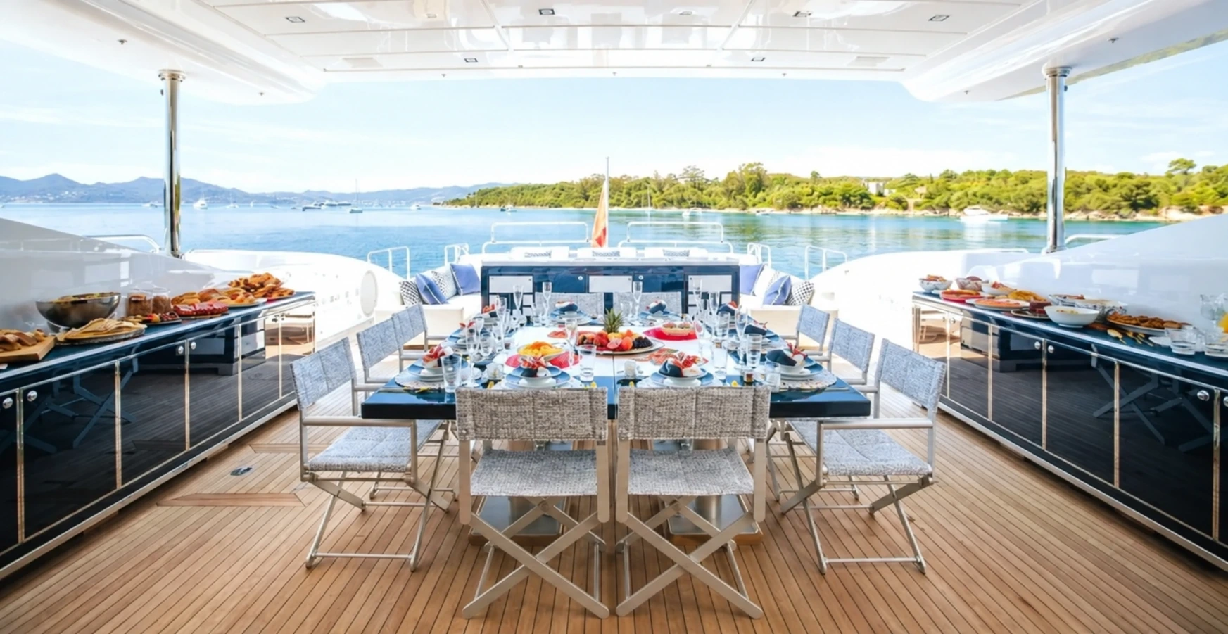 Outdoor dining table prepared for lunch aboard a yacht